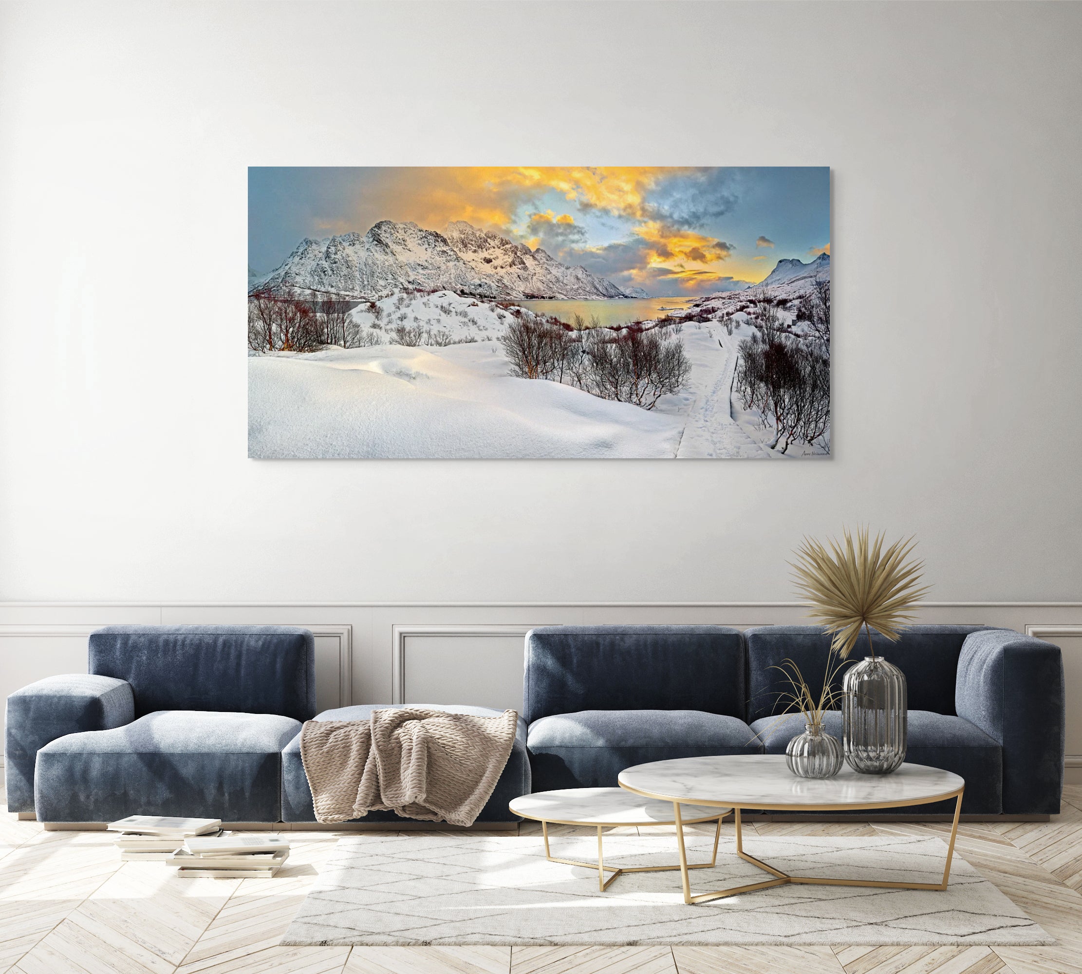 Winter mountain scene in Scandinavia with dramatic sunset and snowy path