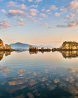 Tranquil sunset reflection on calm waters at Anton Larson Bay
