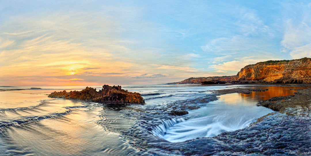 Dawn light over rock pools and cliffs on the Victorian coast