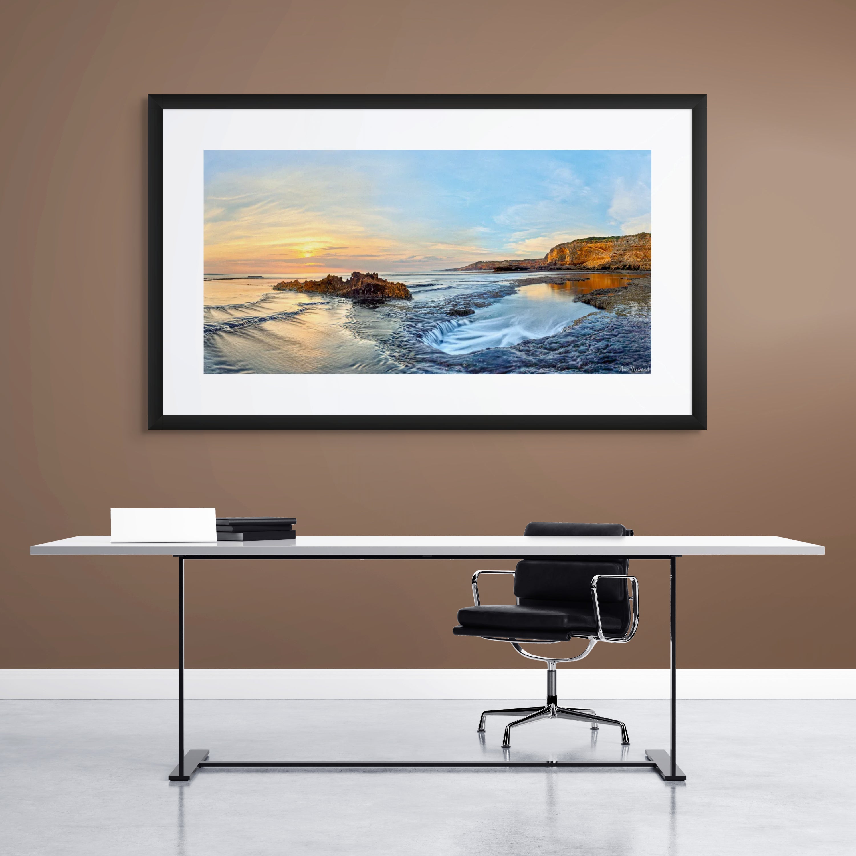 Sunrise seascape with flowing tide and sandstone rock formations