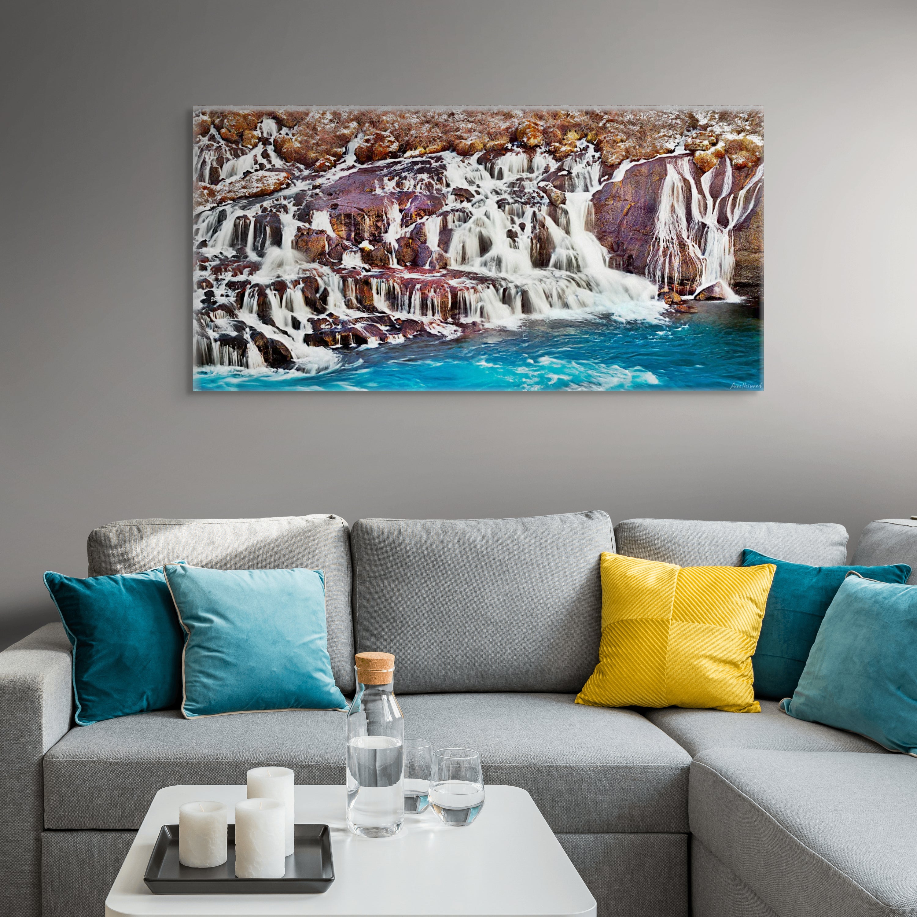Fine art photo of Icelandic waterfall with icy blue water and black stone