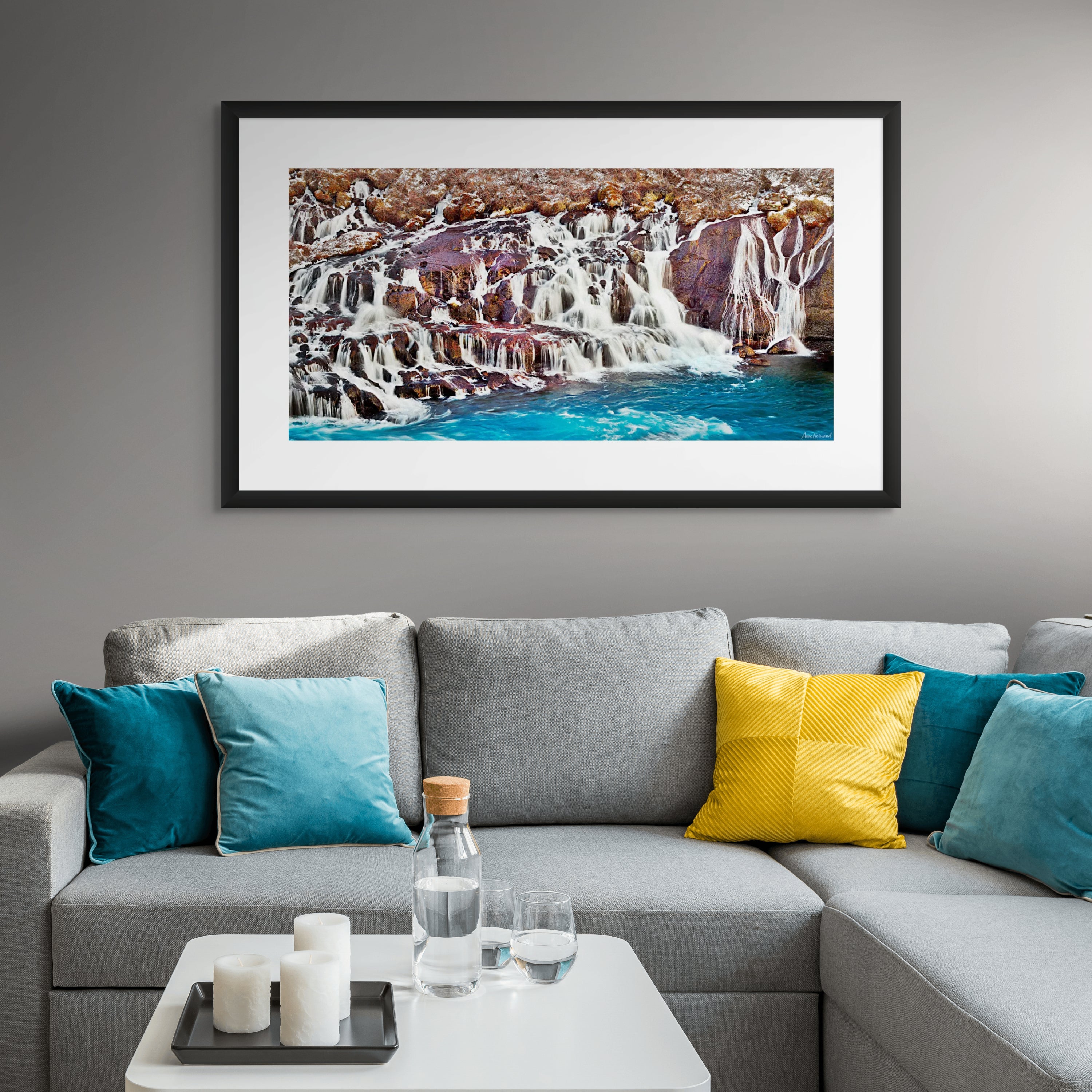 Multiple waterfall streams flowing through dark basalt cliffs in winter
