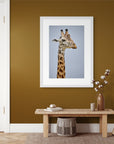 Detailed image of a giraffe's face and neck, showcasing its unique spotted coat. Framed White