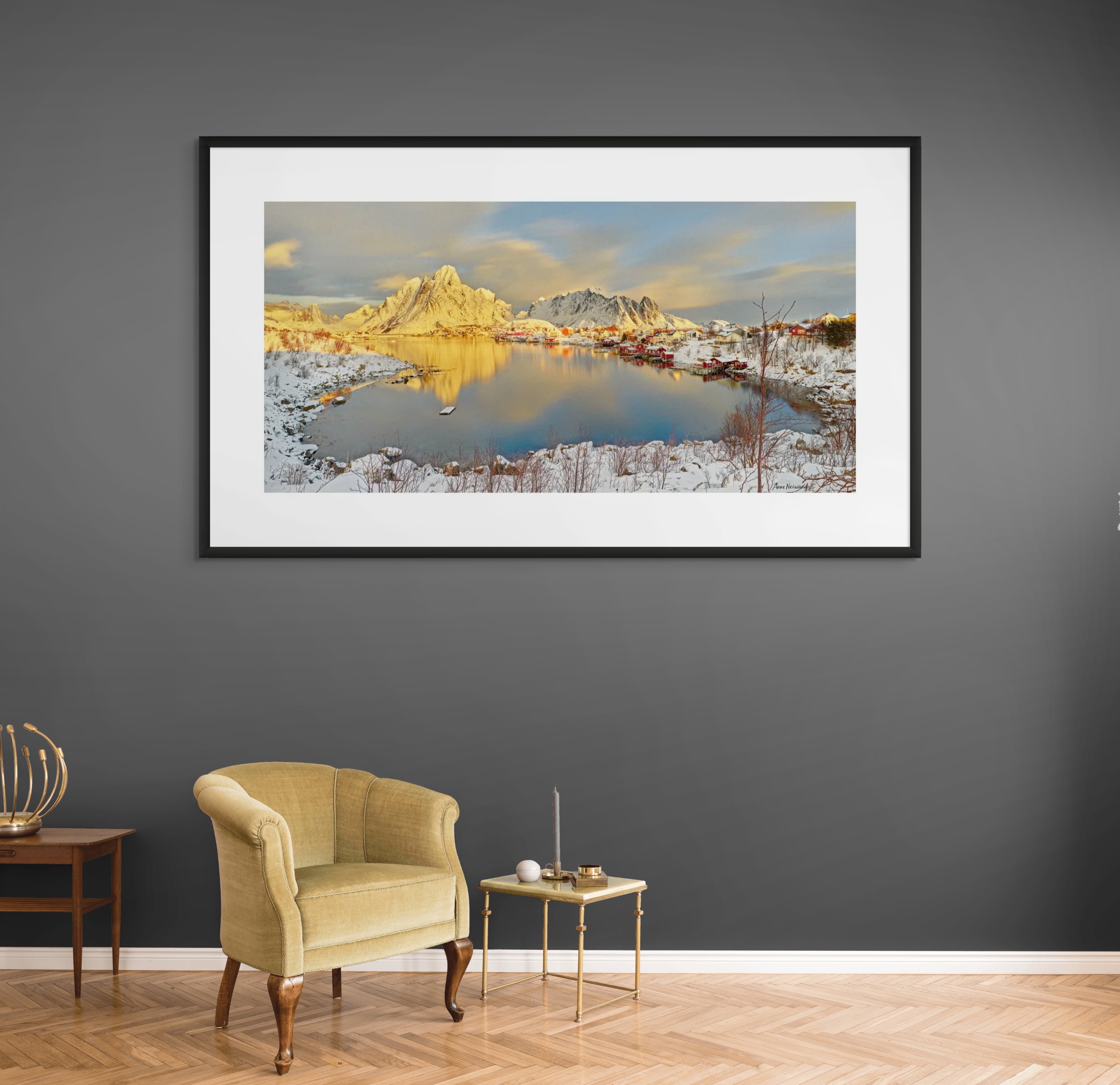Reflection of Scandinavian village and mountains in still water