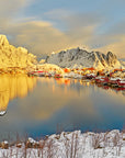 Golden hour photograph of snowy village in Lofoten Islands, Norway