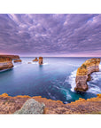 Southern Ocean landscape featuring towering sea stacks and calm tide