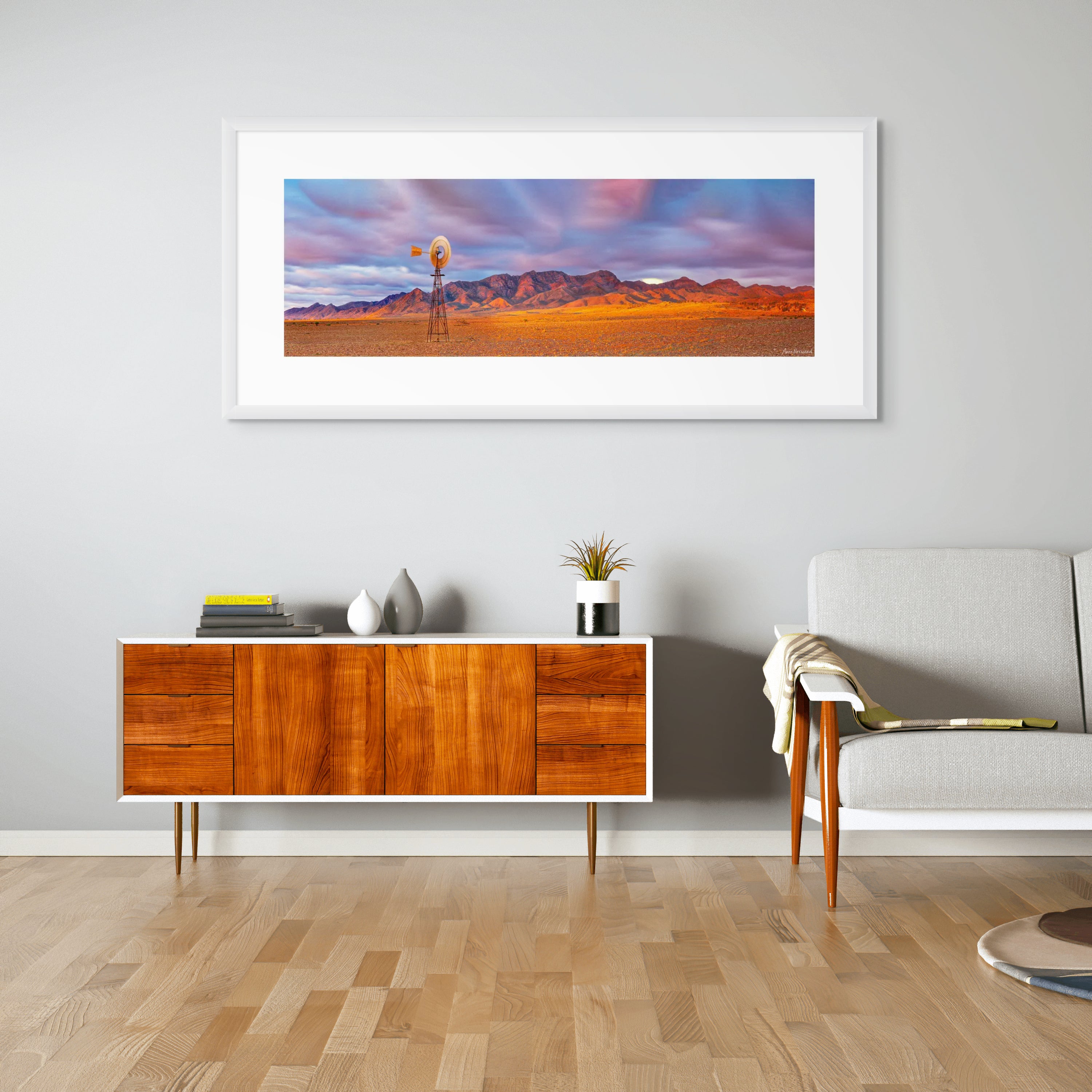 Fine art photograph of Australian outback windmill and rocky range at sunset