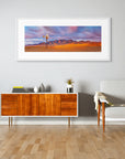 Fine art photograph of Australian outback windmill and rocky range at sunset