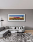 Fine art landscape with Ayers Rock and desert grasses at dawn