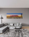 Sacred Australian desert scene with Uluru and spinifex under pastel sky