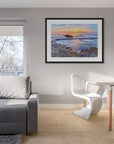 Calm ocean image with gold and lavender reflections on the tide