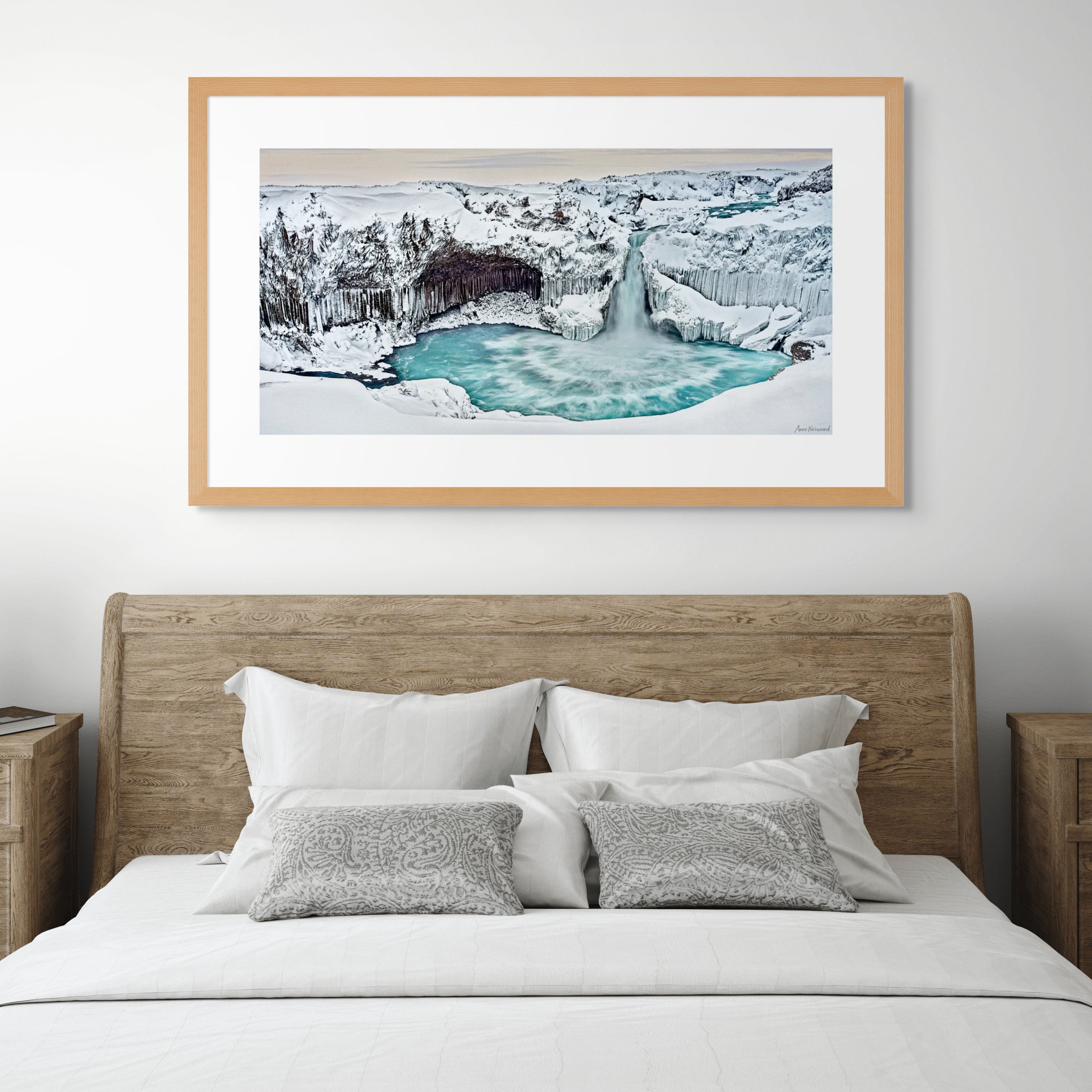 Snow-covered cliffs and icy plunge pool