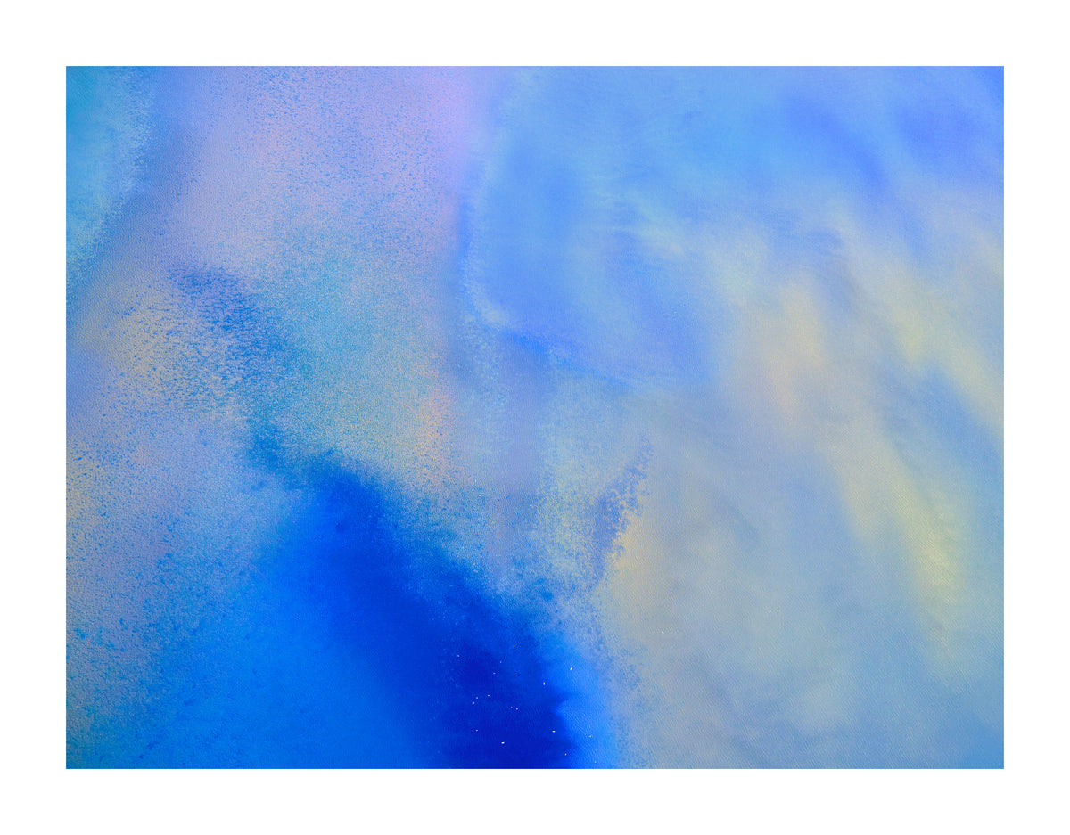 Aerial fine art photograph with cobalt blue and soft pastel tones