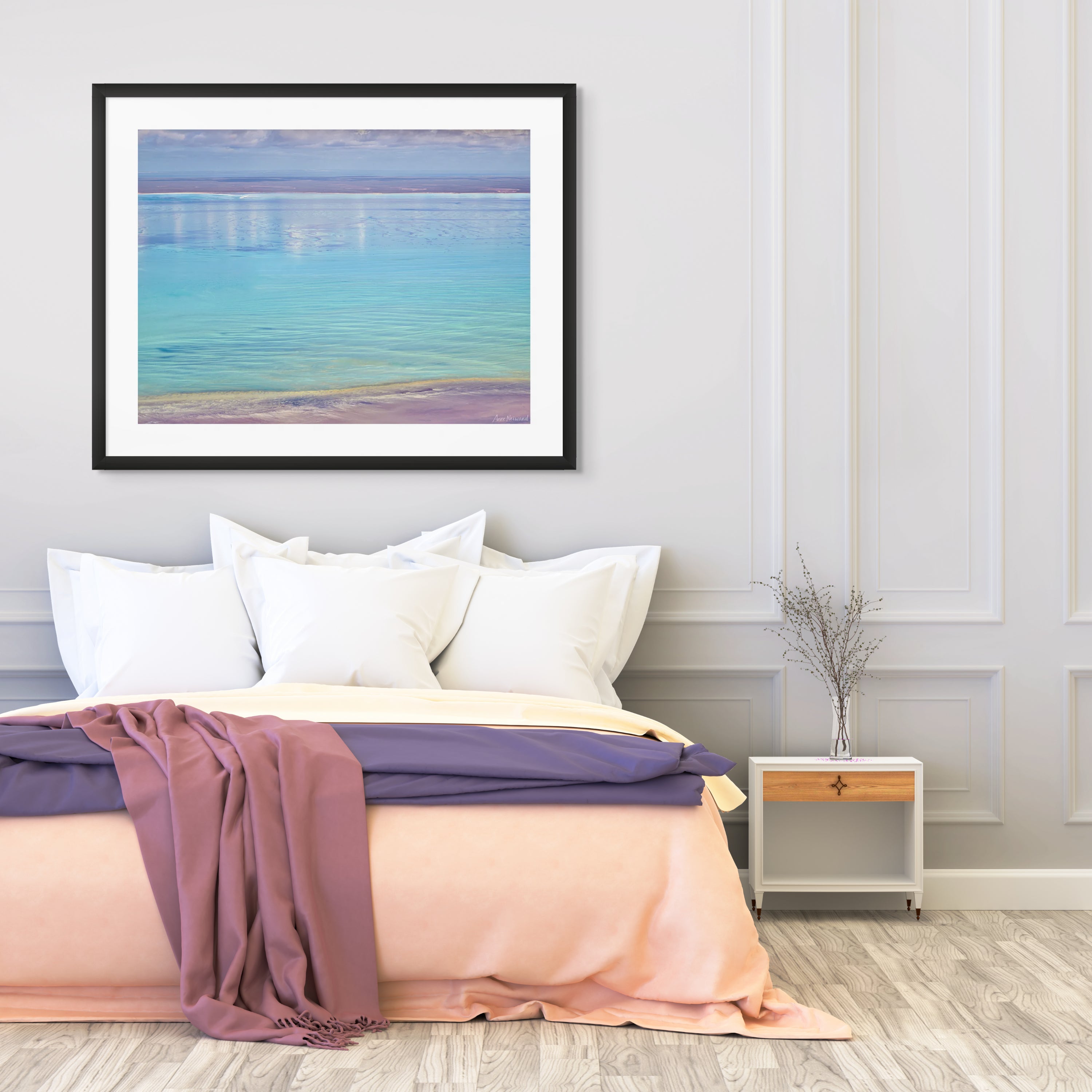Serene blue water with golden and lavender shoreline textures