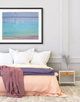 Serene blue water with golden and lavender shoreline textures