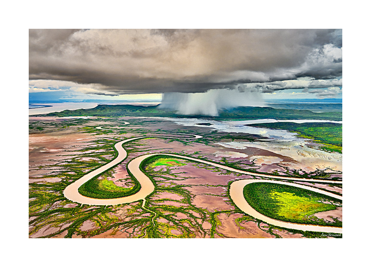 River reflections in floodwaters under dramatic sky