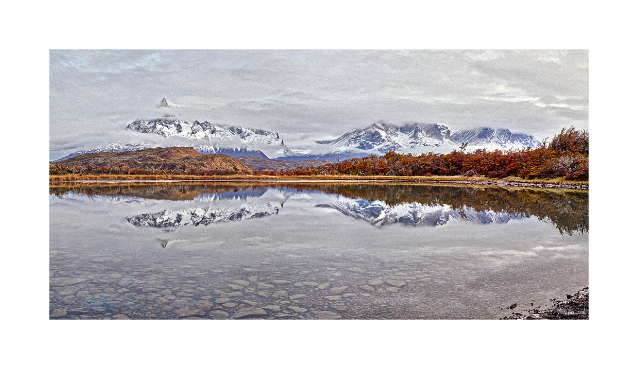 snowy peaks and calm reflections photography