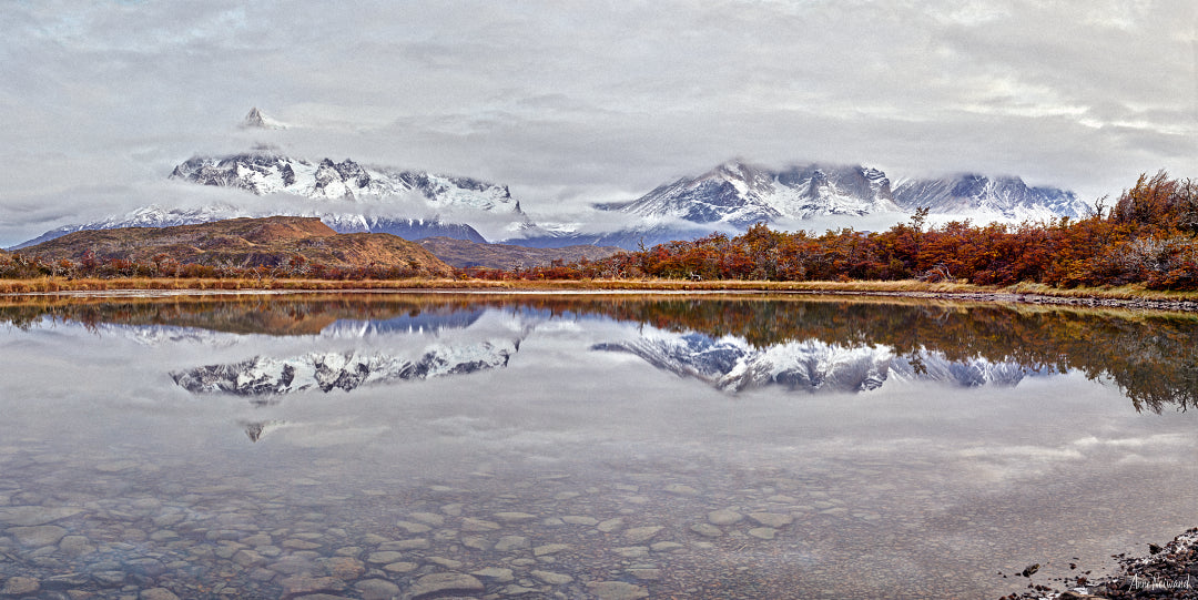 andes mountains reflected in still patagonian lake